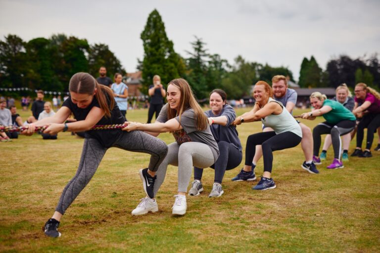 customers at Alderley Park playing tug of rope at sports day