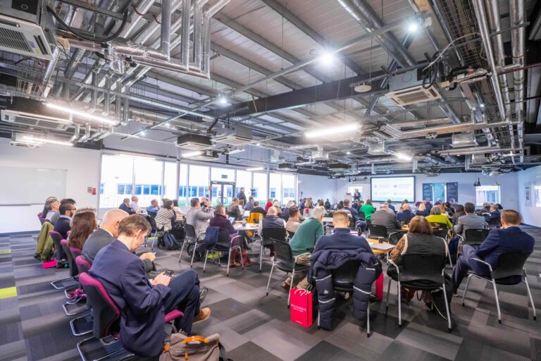 People sat in large conference room