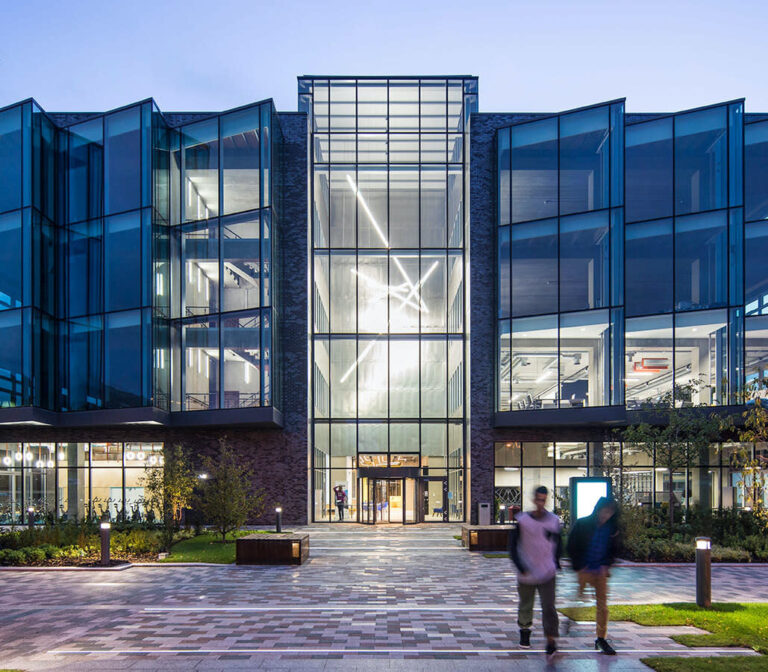 large glass building in the evening light
