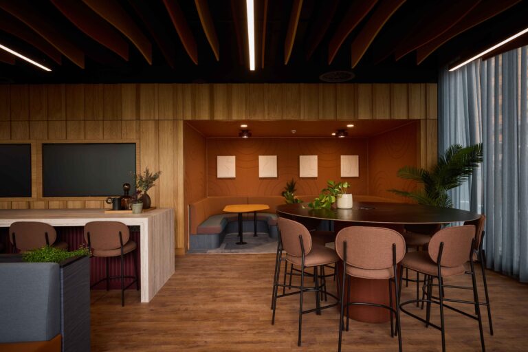 interior lobby of Citylabs 4.0 with table and stools, coworking desks and a breakout space with lounge seating