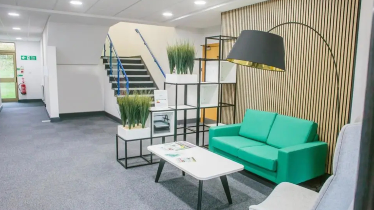 green sofa in reception office space