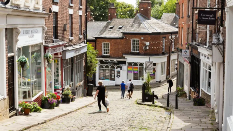 old cobbled street lined with shops
