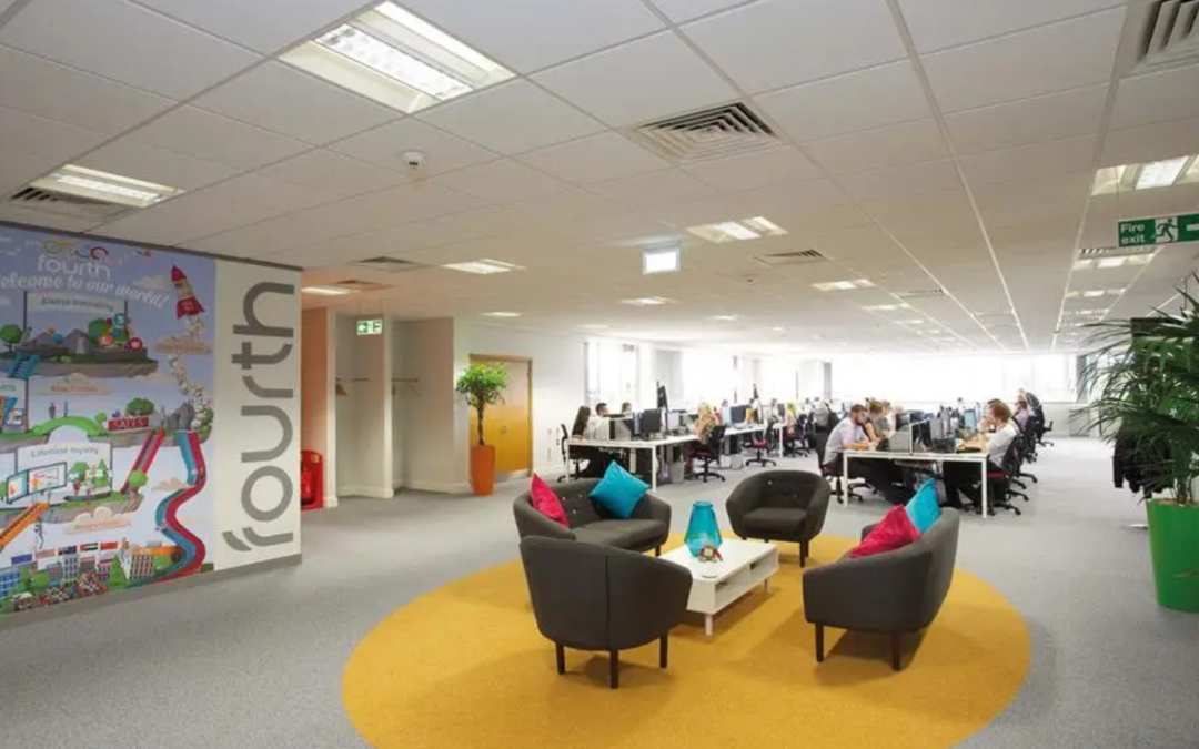 fit out of office space with desks and computers and people sat in chairs