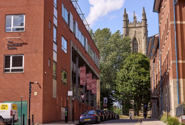 external shot of sheffield innovation centre with church in background