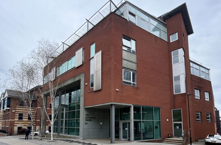external shot of innovation centre sheffield with red brick and 3 storeys