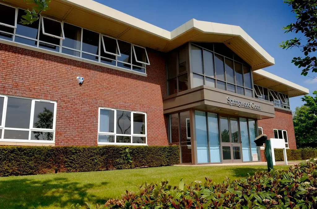 external shot of springwood court office space with sign on frontage