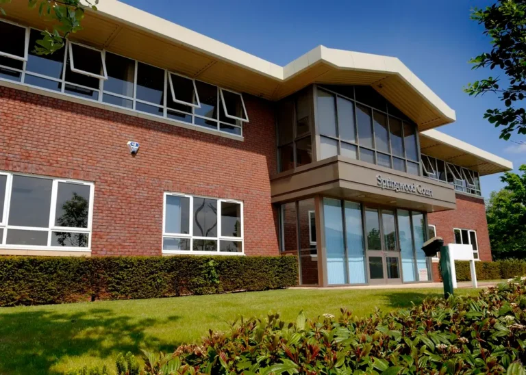 external shot of springwood court office space with sign on frontage